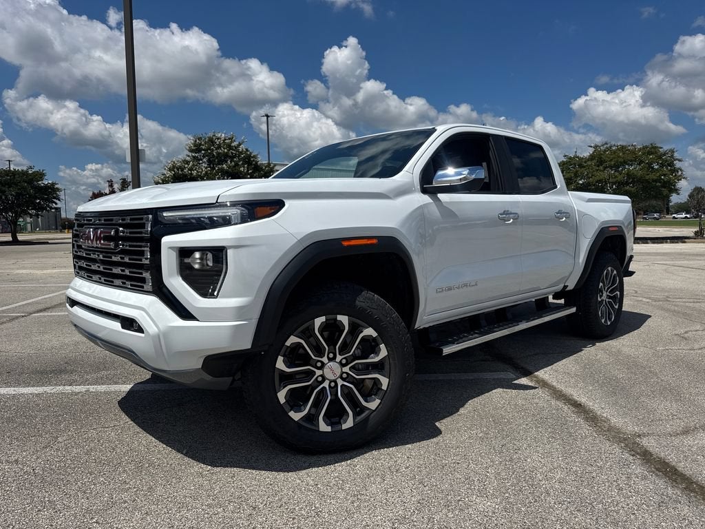 2026 GMC Canyon Denali in Summit White — front three-quarter view