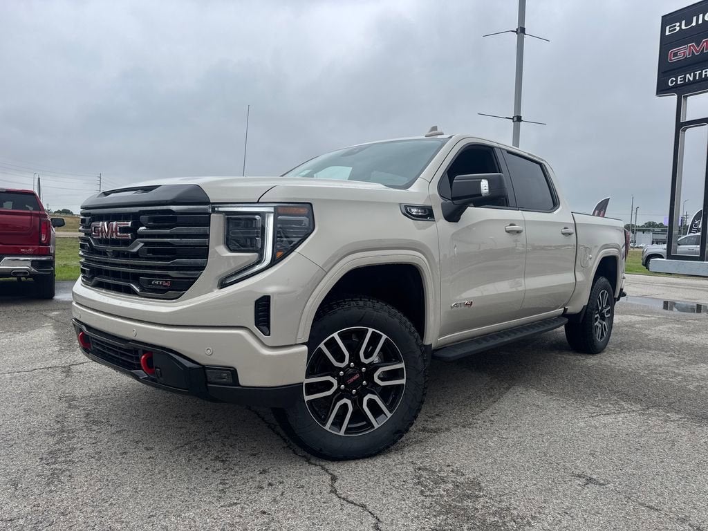 2026 GMC Sierra 1500 AT4 in Coastal Dune — front three-quarter view