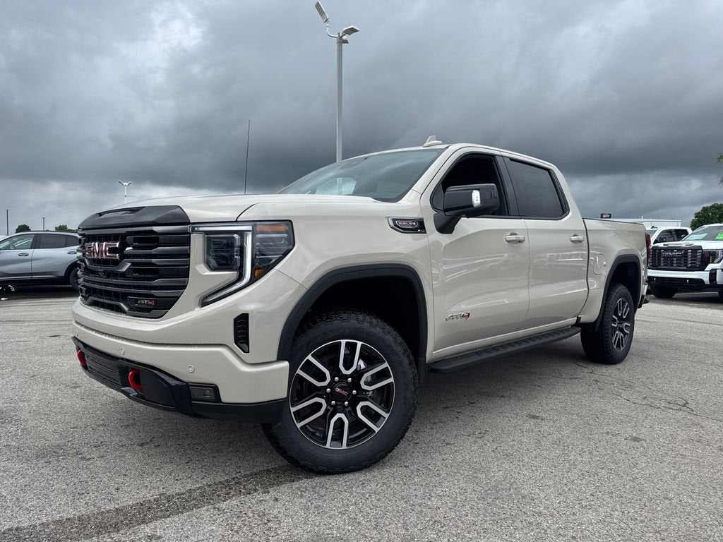 2026 GMC Sierra 1500 AT4 in Coastal Dune — front three-quarter view