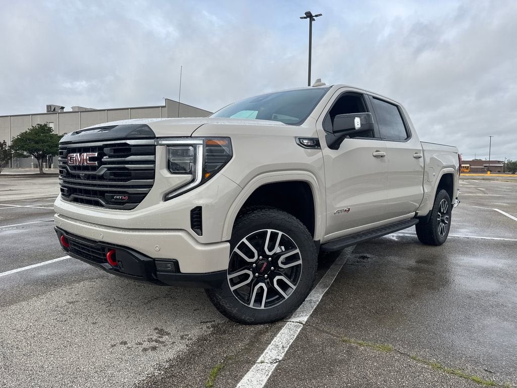 2026 GMC Sierra 1500 AT4 in Coastal Dune — front three-quarter view