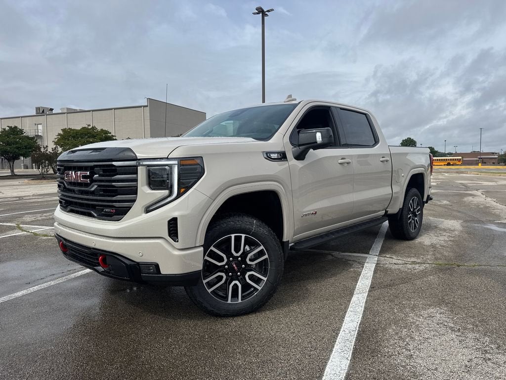 2026 GMC Sierra 1500 AT4 in Coastal Dune — front three-quarter view
