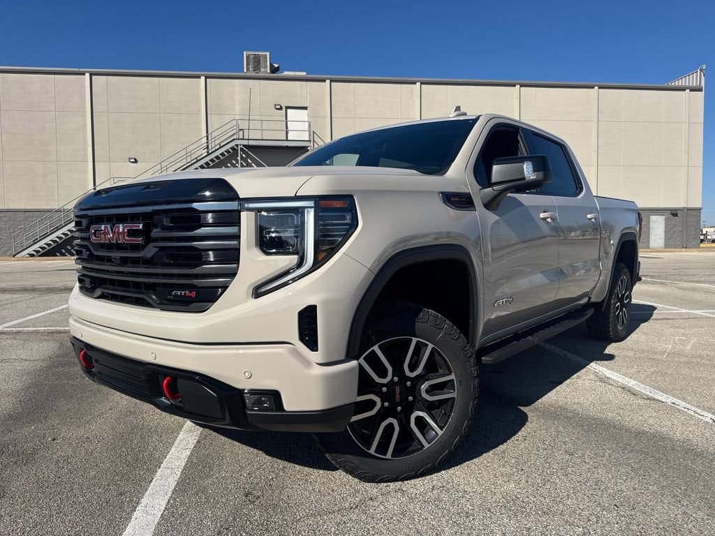 2026 GMC Sierra 1500 AT4 in Coastal Dune — front three-quarter view