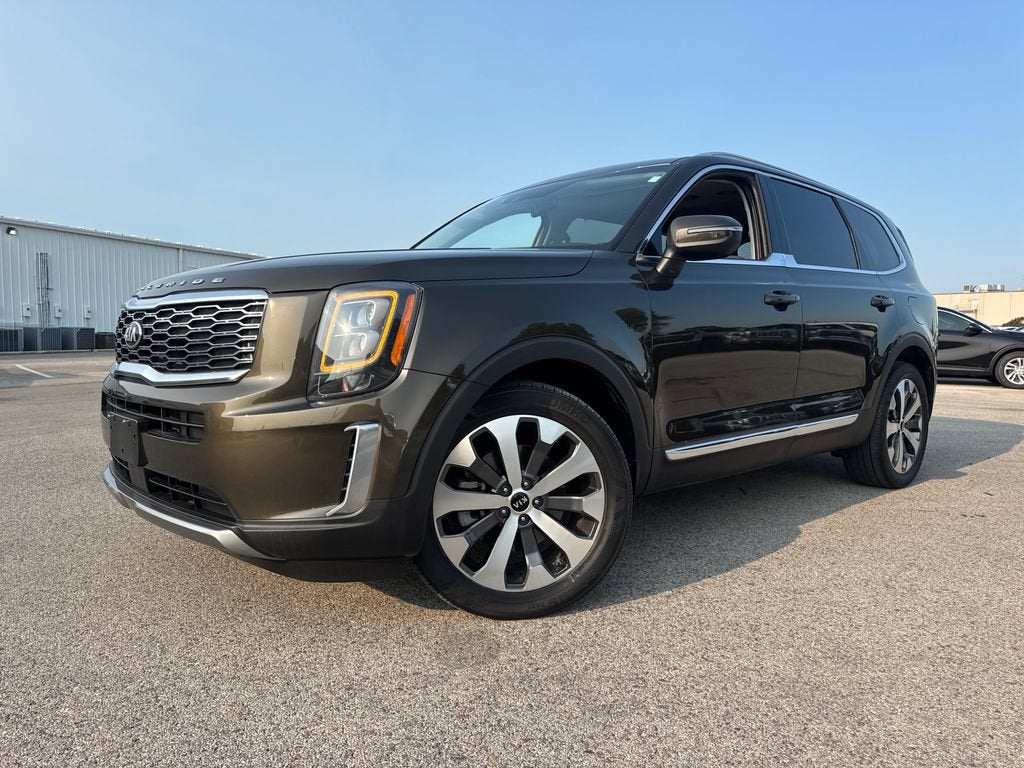 2021 Kia Telluride EX in Dark Moss — front three-quarter view