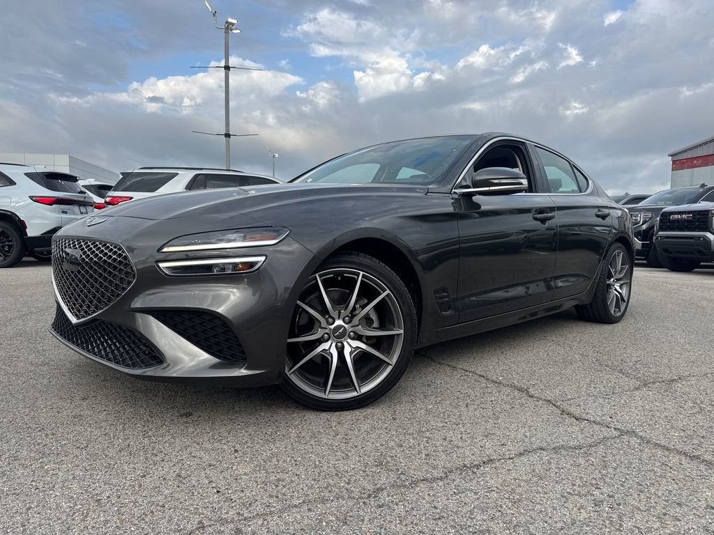 2023 Genesis G70 2.0T in Makalu Gray — front three-quarter view
